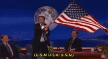 Balthazar Waving American Flag, Chanting USA