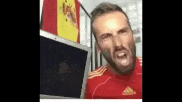 Viva La Espana! Man Shouts with Spanish Flag