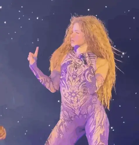 Shakira Performing in a Purple Bodysuit
