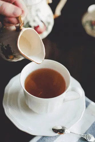 Pouring Milk into Hot Tea