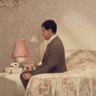 Rowan Atkinson as Mr. Bean Jumping on Bed