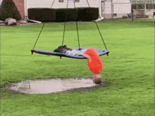 Kid Swings Upside Down into Puddle