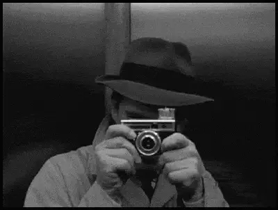 Man Taking Selfie with Flash Camera