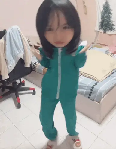 Girl Kicking in Squid Game Tracksuit