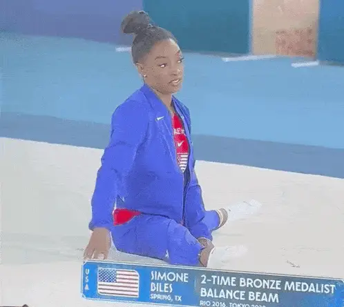 Simone Biles' Iconic Stare & Olympic Achievements