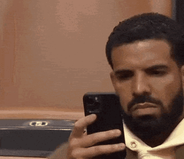 Drake Looks at Phone, Then Reacts