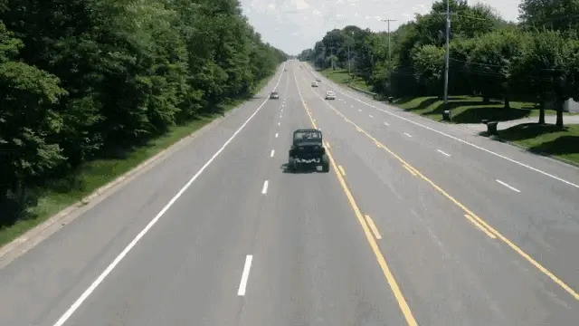 Chase Matthew Driving on Highway