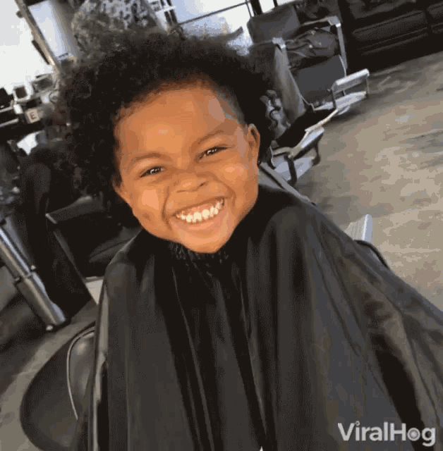 Cute Boy's Big Grin During Haircut