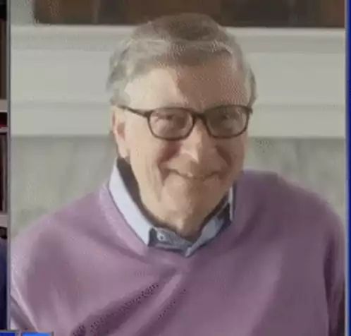 Bill Gates Smiling in Purple Sweater