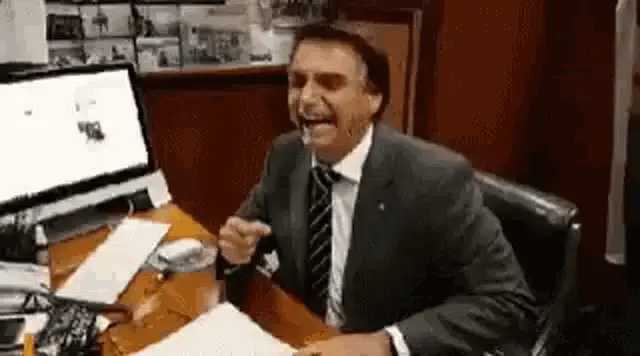 Bolsonaro Laughing and Gesturing