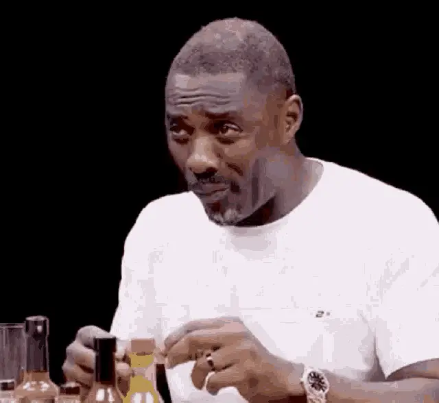 Idris Elba Choking on Hot Sauce