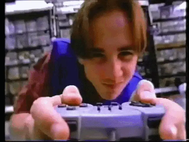 Young Man Playing Video Games Intensely