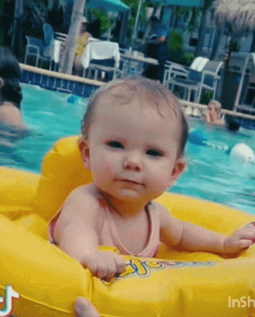 Happy Baby's First Swim in a Yellow Float