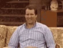 Al Bundy from the sitcom Married With Children doing the finger guns