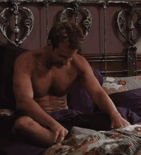 Bradley Cooper Smiling in Bed
