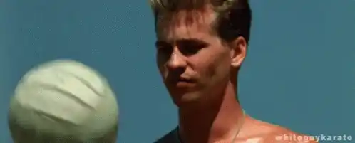Iceman (Val Kilmer) balances volleyball