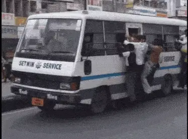 Iu: People Hanging on Bus in India