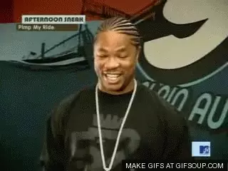 Xzibit Smiling with Pimp My Ride Sign