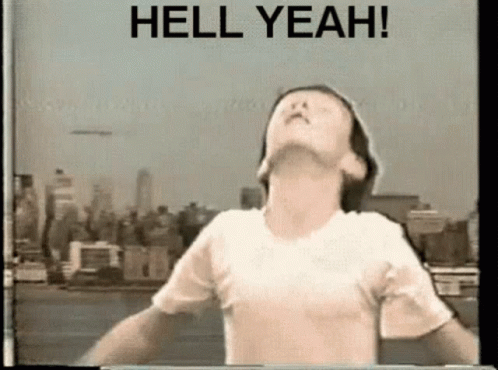 A classic VHS-style video of a gay kid voguing over images on New York with the phrase Hell Yeah above him.