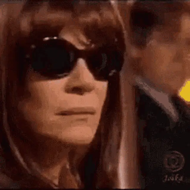Woman in Sunglasses Reacts