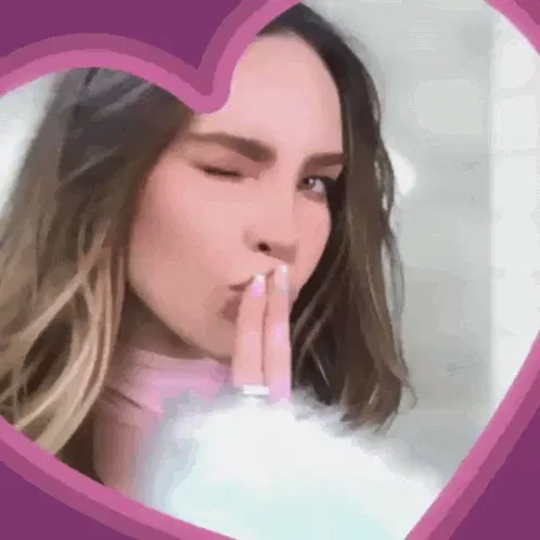 Belinda Winks and Blows a Kiss