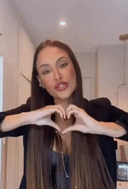 Sarah Andrade Makes a Heart with Her Hands