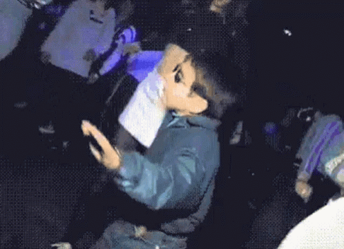 Boy dancing in club with sunglasses