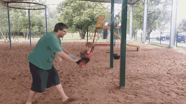 Man and Child Playing on Swing