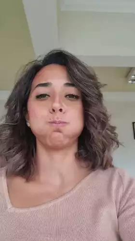 Woman Puffing Cheeks Playfully