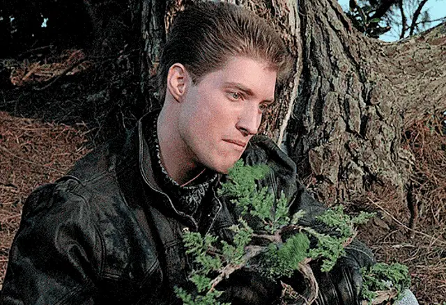 Barnes Examining a Bonsai Tree