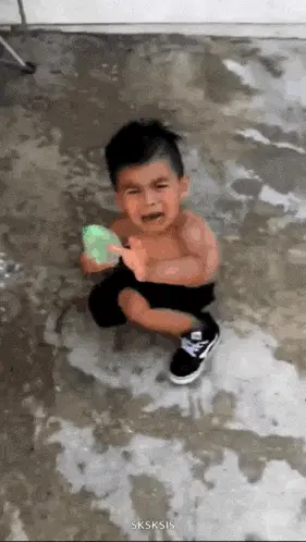 Little Boy Cries Over Water Balloon