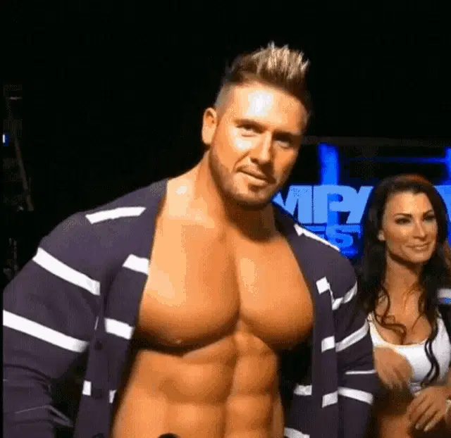 Bodybuilder Flexing Pec Muscles at IMPACT
