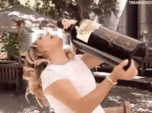 Woman drinks giant bottle of wine