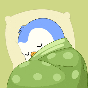 Sleepy Penguin Napping Under Blanket