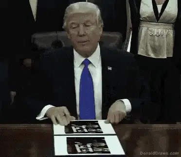 Donald Trump holds up a picture of himself meme