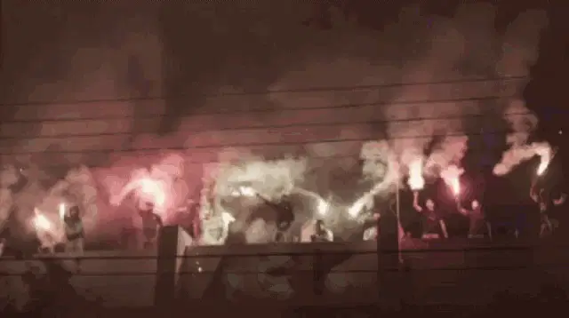 AEK Larnaca Fans Celebrate with Flares