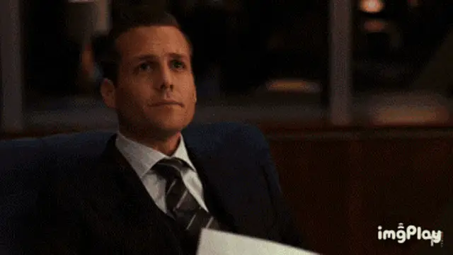 Harvey Specter Holding Paper