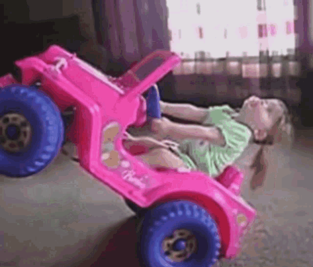 Bored Little Girl in Pink Barbie Car
