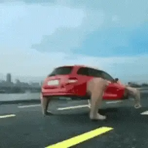 Red Car with Legs Walking on Road