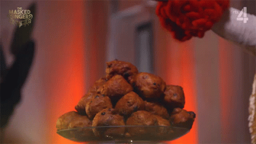 Sprinkling Powdered Sugar on Oliebollen