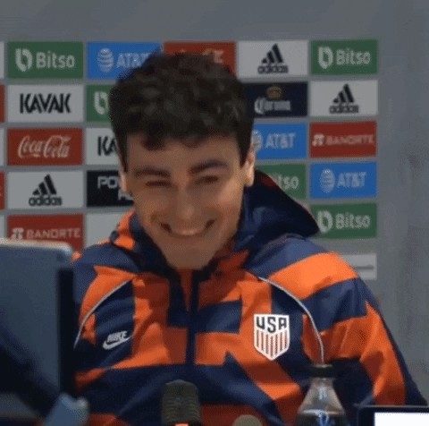 Healthygio (Giovanni Reyna) laughs at presser
