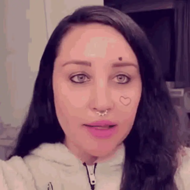 Amanda Bynes with Heart Tattoo and Septum Piercing