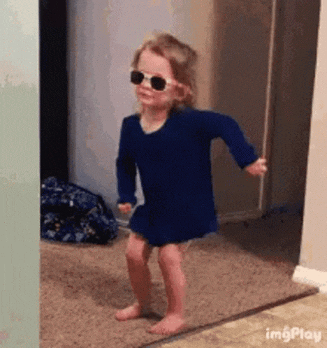 Little Girl Dancing Happy Dance in Sunglasses
