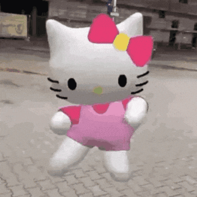 Hello Kitty dancing in a pink dress