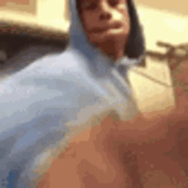 Man in Blue Hoodie Punching