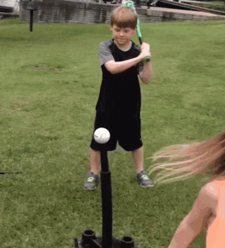 Boy Practicing Tee Ball