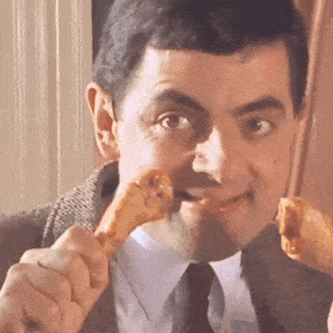 Rowan Atkinson (Mr. Bean) Eating Chicken