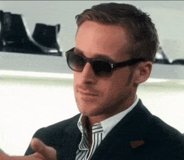 Ryan Gosling Adjusting Sunglasses