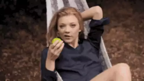 Natalie Dormer Eating Apple in Hammock