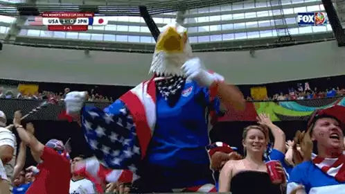 USA Soccer Fan Cheers with Eagle Mascot